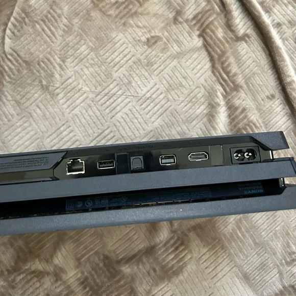 PS4 Pro + Controller + Power Cord + HDMI Cord + 2 Games